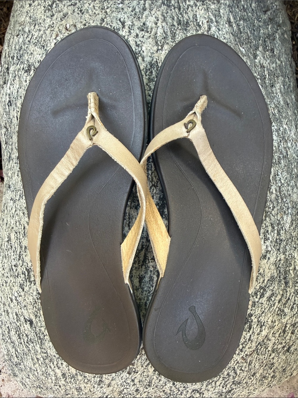 OluKai tan flip flops